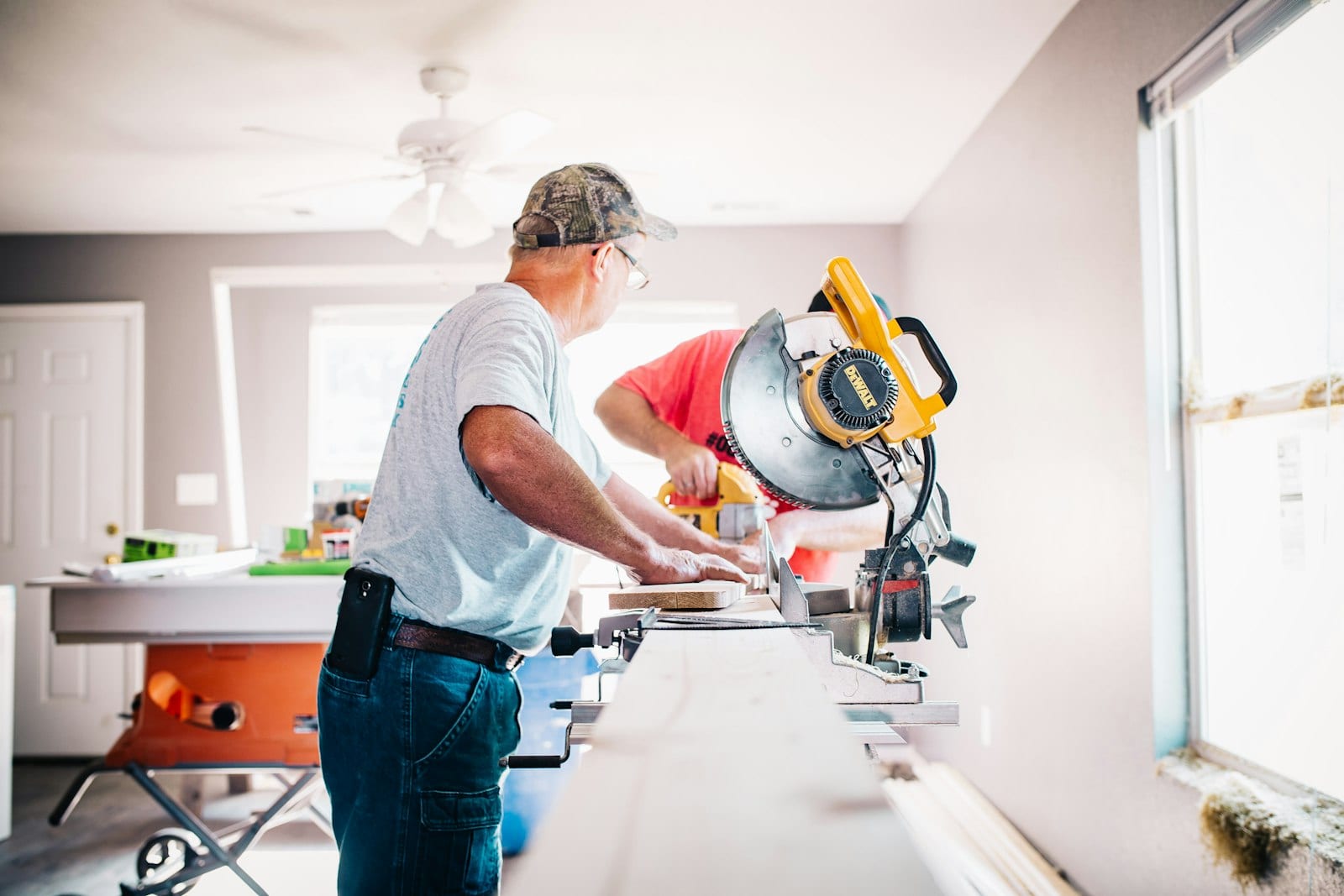 Contractor using a miter saw during a home renovation